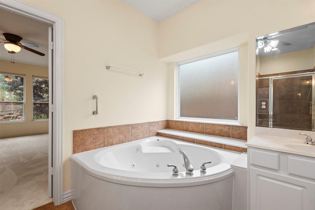 bathroom featuring separate shower and tub, ceiling fan, and vanity