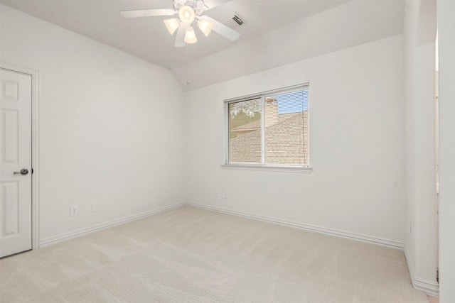 empty room with light carpet, ceiling fan, and lofted ceiling