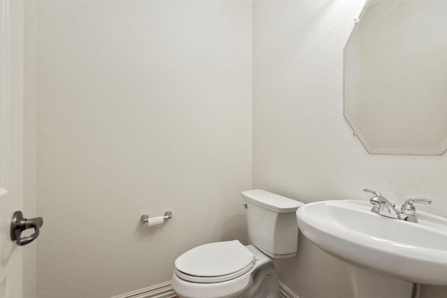 bathroom with sink and toilet