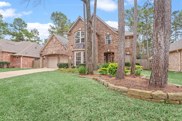 view of front of house with a front yard and a garage