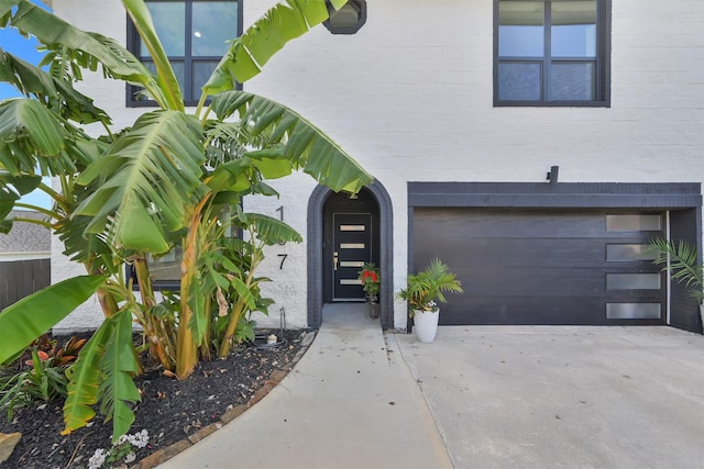 doorway to property featuring a garage