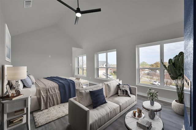 bedroom featuring ceiling fan, wood-type flooring, and vaulted ceiling