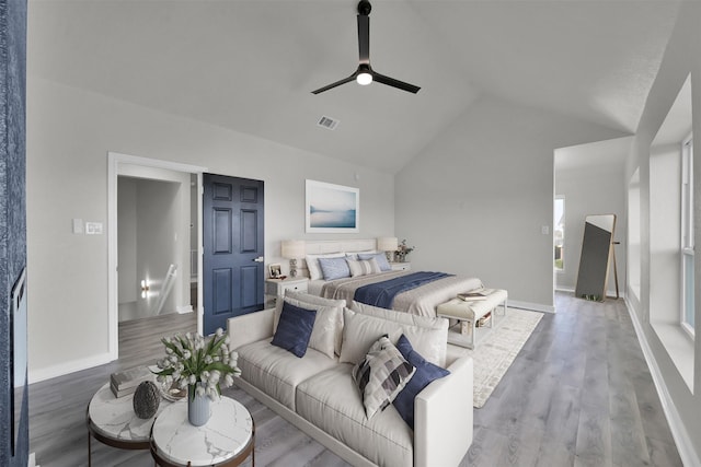 bedroom featuring ceiling fan, high vaulted ceiling, and hardwood / wood-style flooring