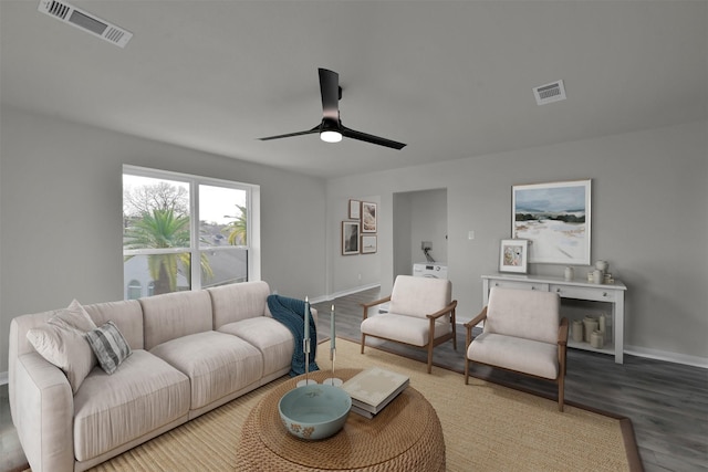 living room featuring hardwood / wood-style floors and ceiling fan