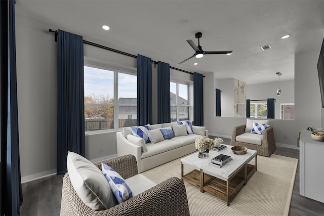 living room with a healthy amount of sunlight, ceiling fan, and wood-type flooring