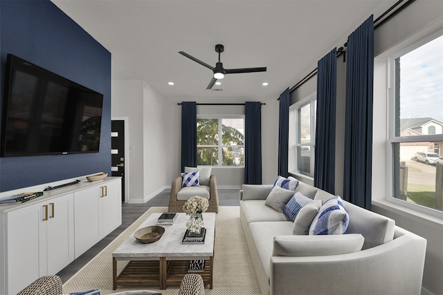 living room with hardwood / wood-style flooring, plenty of natural light, and ceiling fan