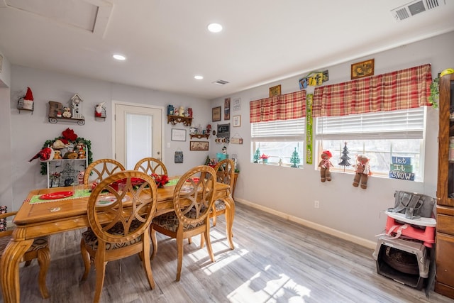 dining space featuring light wood-type flooring