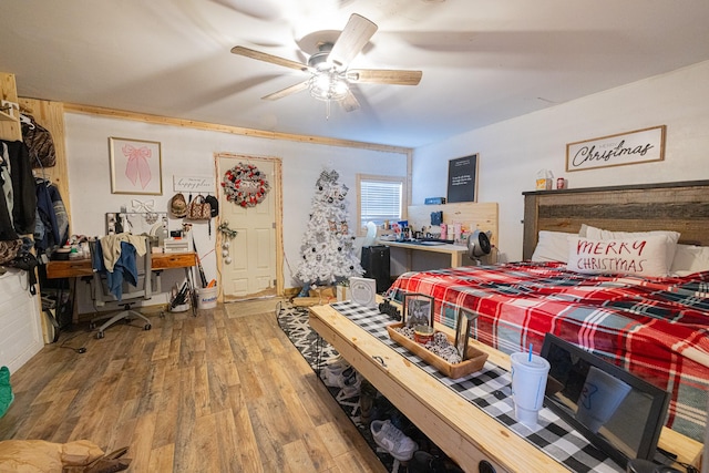 bedroom featuring ceiling fan and wood-type flooring