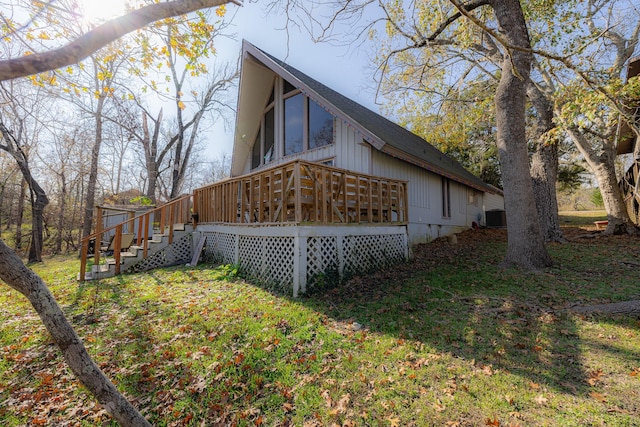 view of home's exterior with a deck and central AC