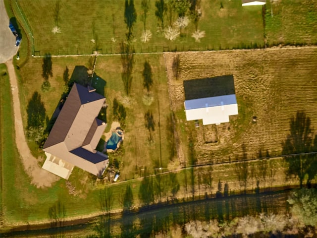 birds eye view of property with a rural view