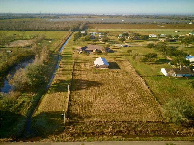 birds eye view of property featuring a rural view