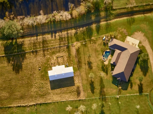 birds eye view of property with a rural view