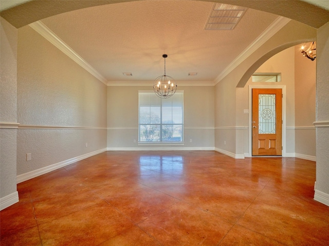 spare room with ornamental molding, a textured ceiling, and a notable chandelier