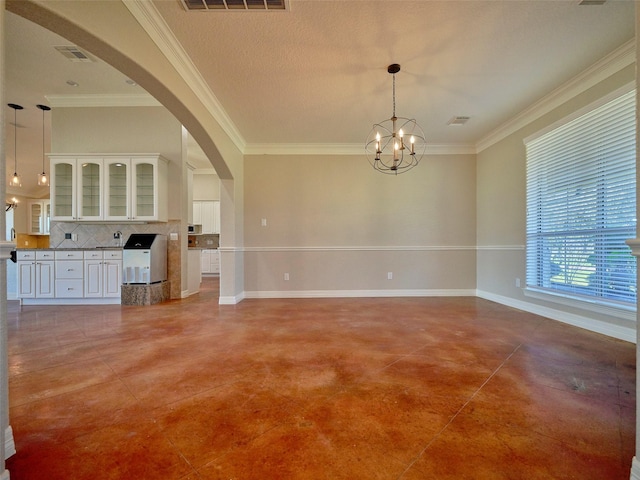 interior space featuring a notable chandelier and crown molding