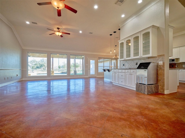 unfurnished living room featuring ceiling fan, light tile patterned floors, and crown molding