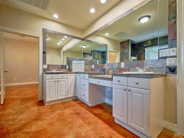 kitchen featuring sink, white cabinets, and hanging light fixtures