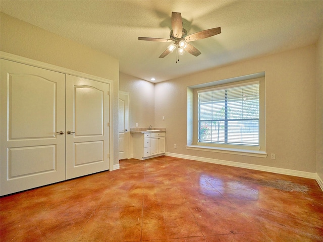 interior space with ceiling fan