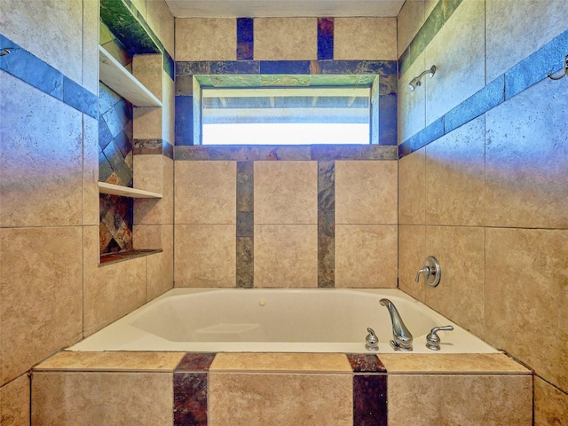 bathroom featuring tiled bath