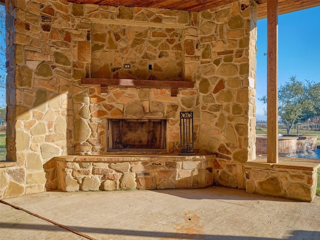 interior details with an outdoor stone fireplace