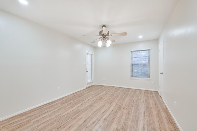 spare room with ceiling fan and light hardwood / wood-style floors