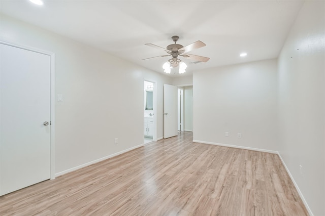 empty room featuring light wood-type flooring and ceiling fan