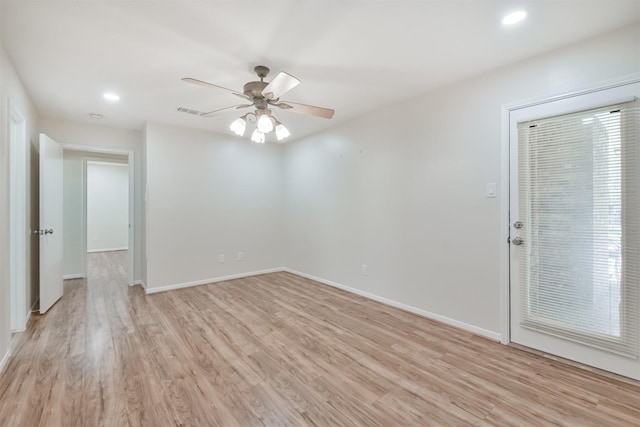 spare room featuring ceiling fan and light hardwood / wood-style floors