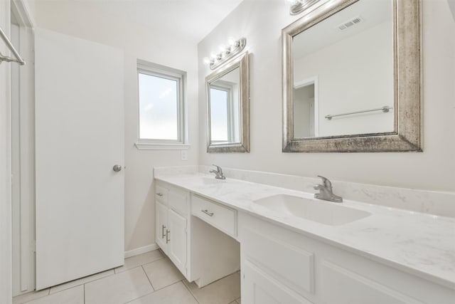 bathroom featuring tile patterned floors and vanity