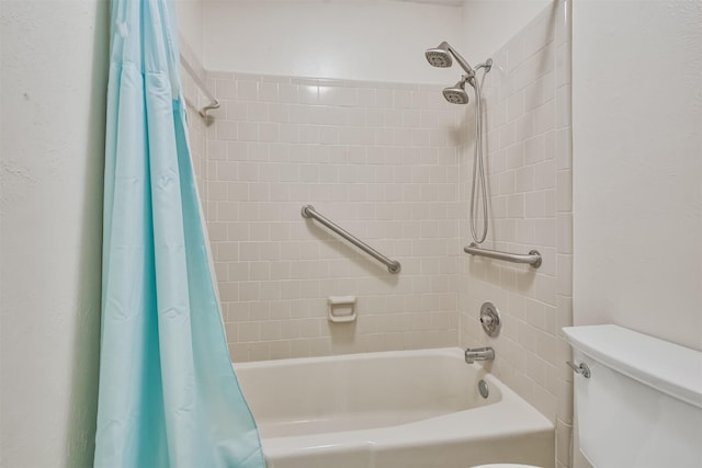 bathroom with shower / bath combo with shower curtain and toilet