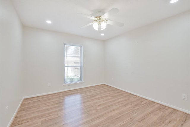 unfurnished room featuring light wood-type flooring and ceiling fan