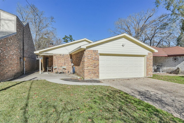 view of front facade with a garage and a front lawn