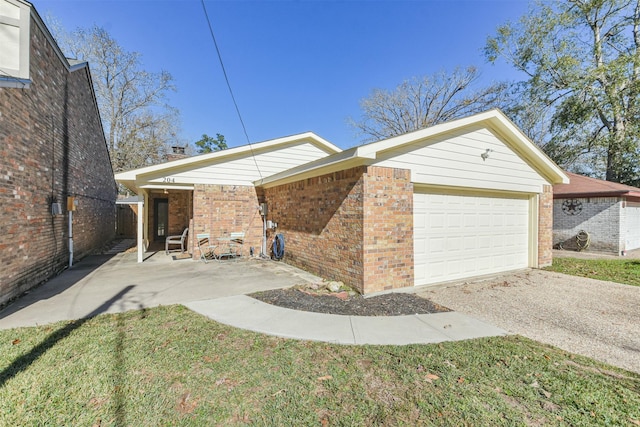 view of property exterior featuring a garage and a yard