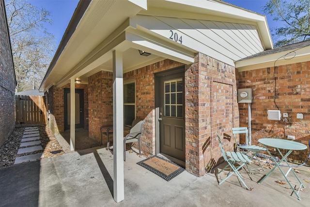 property entrance featuring a patio