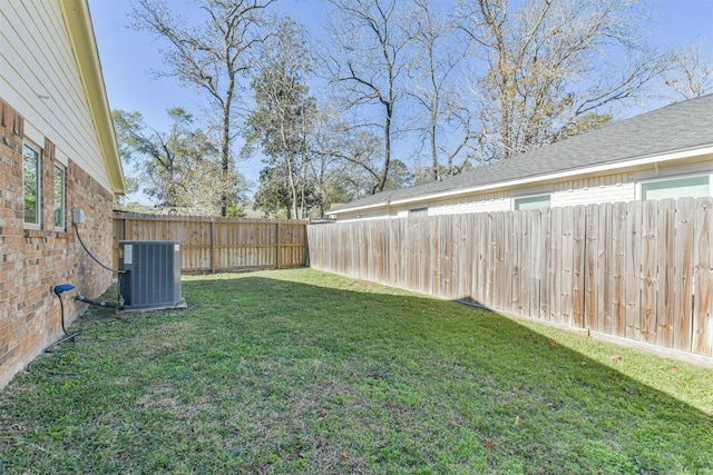 view of yard with central air condition unit