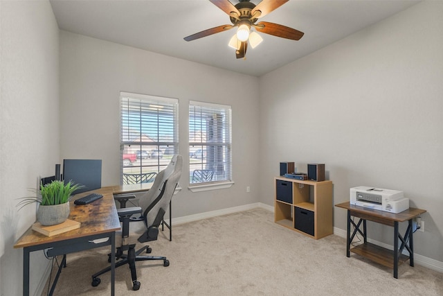 office featuring light carpet and ceiling fan