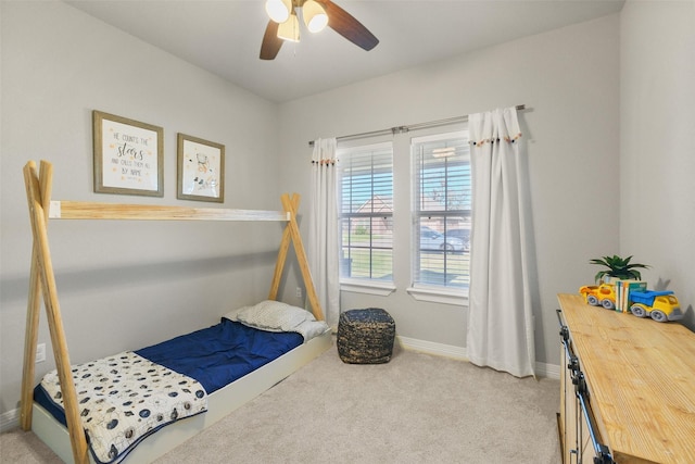 bedroom with light colored carpet and ceiling fan