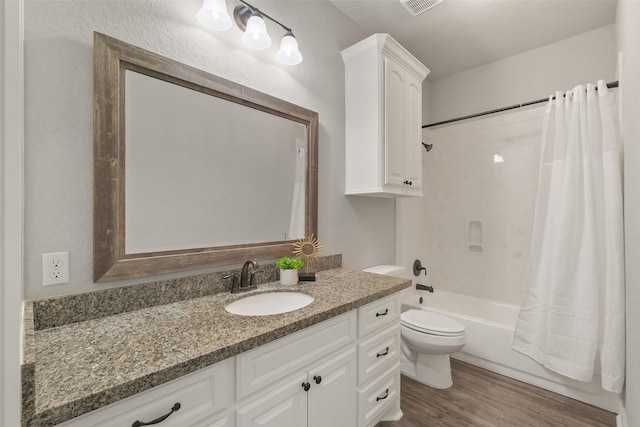 full bathroom with toilet, shower / bath combo with shower curtain, vanity, and hardwood / wood-style flooring