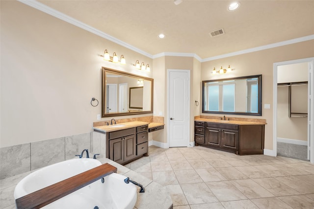 bathroom with a tub, crown molding, and vanity