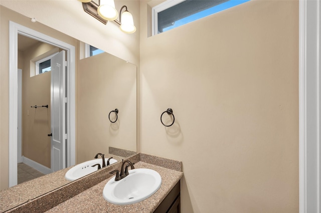 bathroom with tile patterned floors and vanity