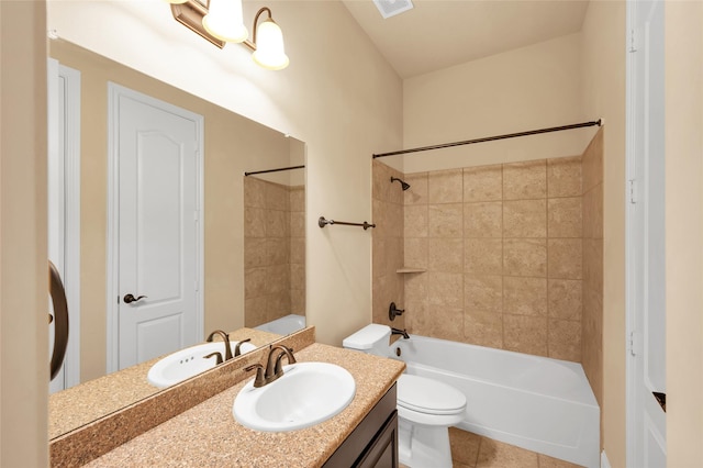 full bathroom with toilet, vanity, tiled shower / bath combo, and tile patterned flooring