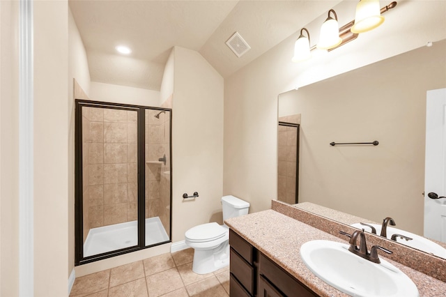 bathroom with vanity, vaulted ceiling, tile patterned flooring, toilet, and a shower with shower door