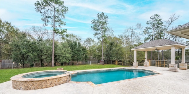 view of pool featuring a gazebo, a yard, an in ground hot tub, and a patio