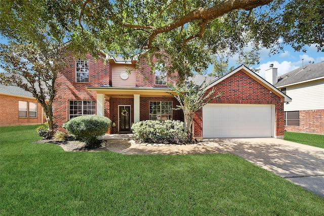 traditional-style house with a garage, driveway, a front lawn, and brick siding