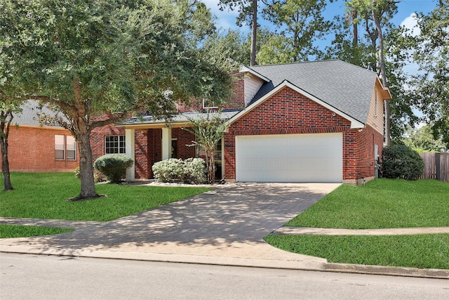 traditional-style house featuring concrete driveway, brick siding, an attached garage, and a front yard