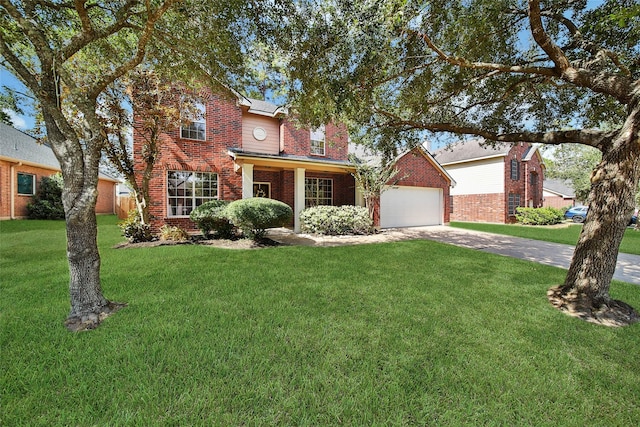 view of front of home with a front yard and a garage