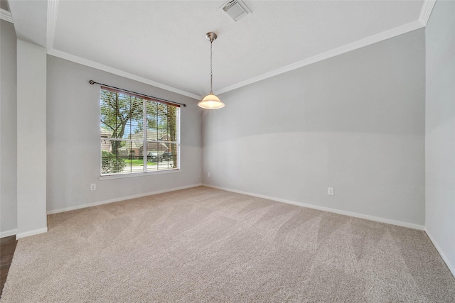 carpeted empty room featuring baseboards, visible vents, and crown molding