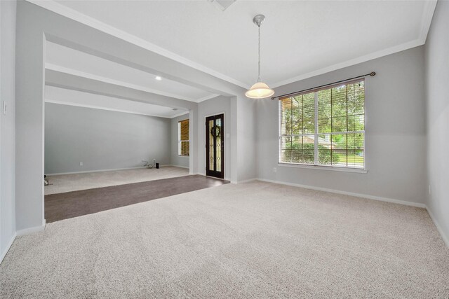 spare room with dark colored carpet and ornamental molding