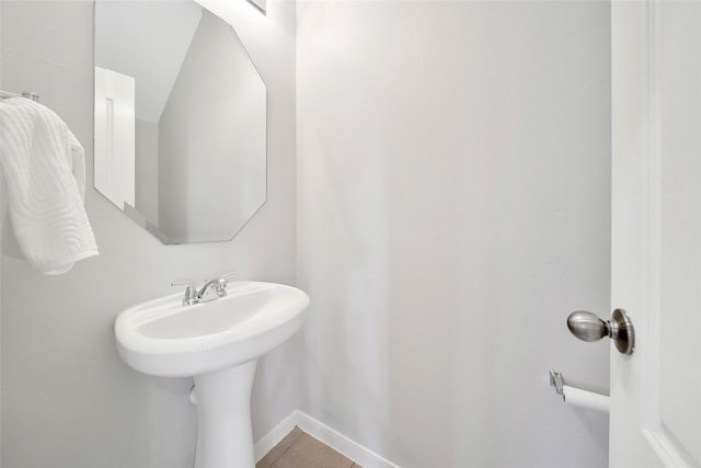 bathroom featuring tile patterned flooring and baseboards