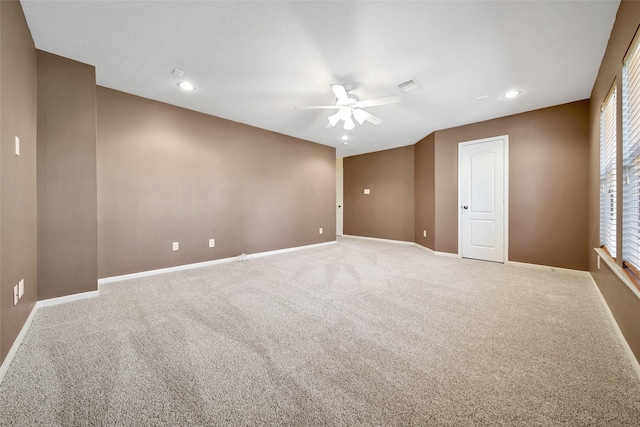 empty room featuring baseboards, visible vents, ceiling fan, carpet floors, and recessed lighting