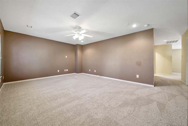 unfurnished room featuring light carpet, baseboards, and visible vents