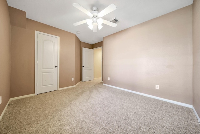 unfurnished bedroom with ceiling fan and light colored carpet